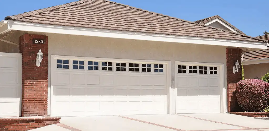 Residential garage door repair service for a double garage door in Tuscaloosa, AL