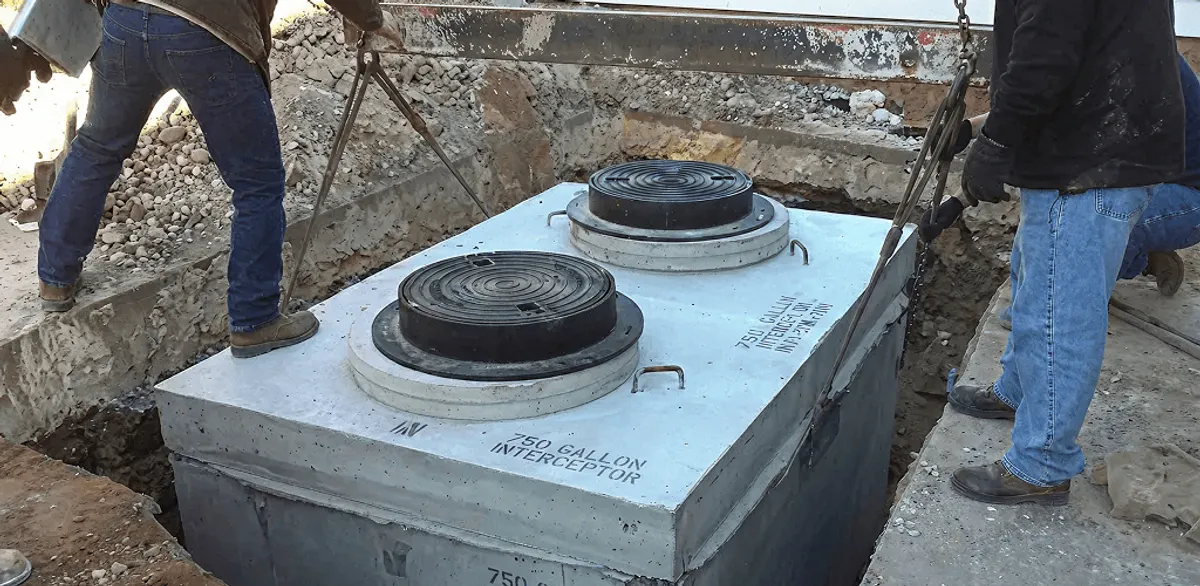 Grease trap installation for a commercial property drainage system in Tuscaloosa, AL