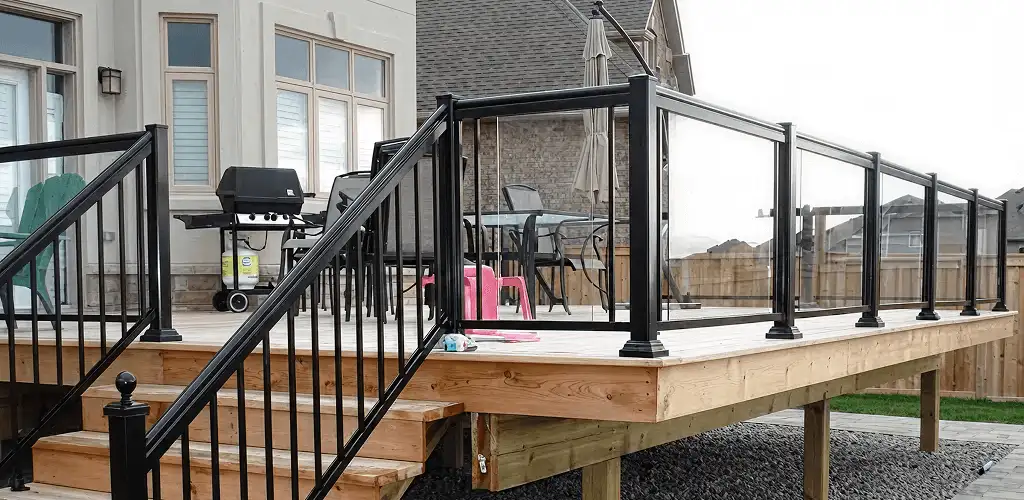 Handrail installation on a deck staircase for safety and code compliance in Tuscaloosa, AL